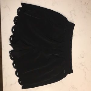 Black, scalloped edge, cut out detail shorts.